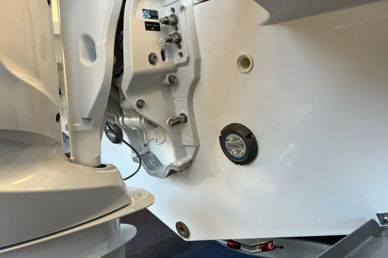 Slide: The Image of 2025 Pursuit DC 246 Dual Console boat engine and hull detail. - 3