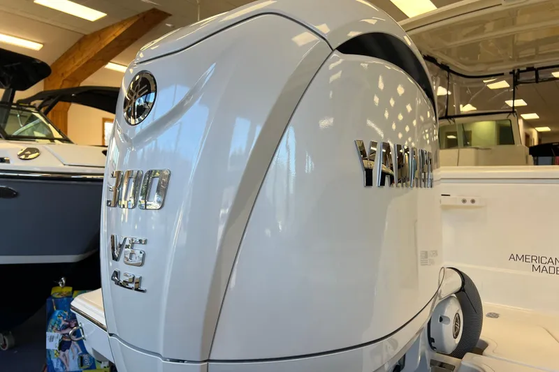 Slide: The Image of 2025 Pursuit DC 246 Dual Console with Yamaha 300 V6 engine in showroom. - 4