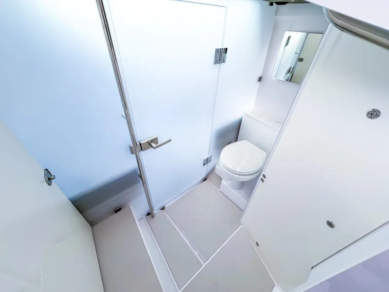 Slide: The Image of 2024 Axopar 37XC CROSS CABIN bathroom with modern shower and toilet. - 15