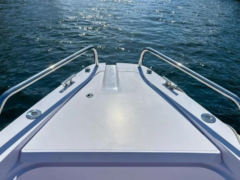 Slide: The Image of Bow view of 2024 Axopar 37XC CROSS CABIN on water. - 4