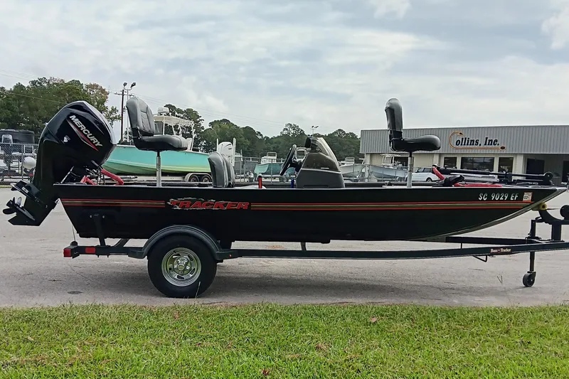 Slide: The Image of 2023 Tracker Bass Tracker Classic XL boat on trailer, parked outdoors. - 4