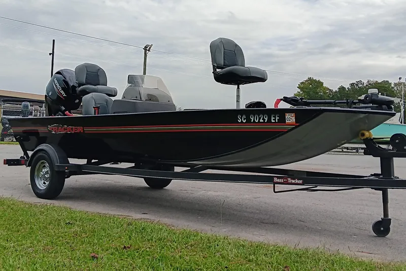 Slide: The Image of 2023 Tracker Bass Tracker Classic XL boat on trailer, parked outdoors. - 5