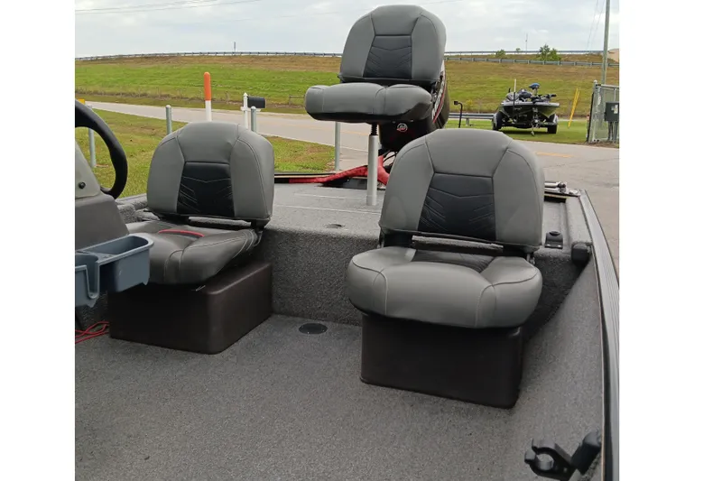 Slide: The Image of 2023 Tracker Bass Tracker Classic XL boat interior with three gray seats. - 9