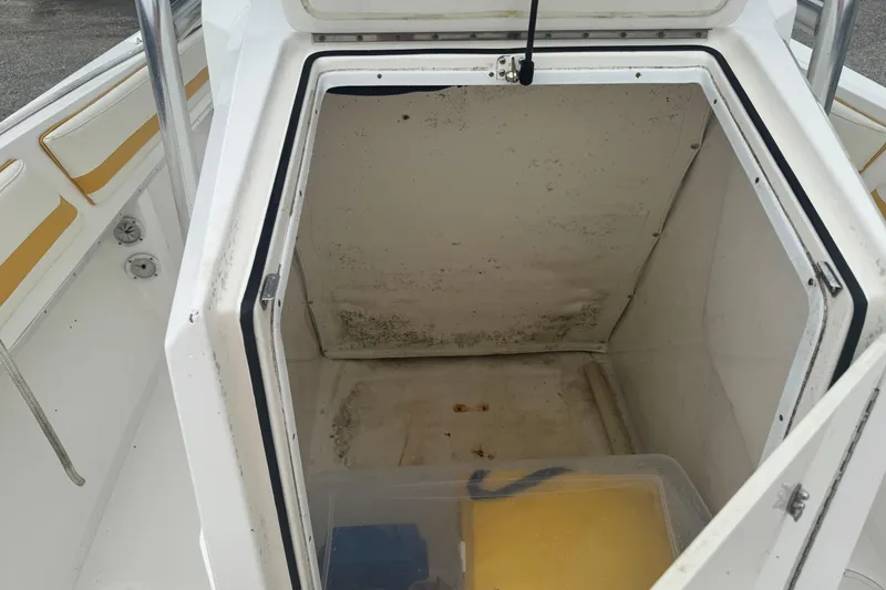 Slide: The Image of Open storage compartment on 2004 Fountain 31 Sportfish CC Open Bow boat. - 13