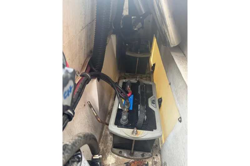 Slide: The Image of Battery compartment of a 2004 Fountain 31 Sportfish CC Open Bow boat. - 16