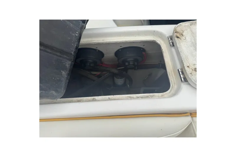 Slide: The Image of Open hatch of 2004 Fountain 31 Sportfish CC, showing internal components and wiring. - 17