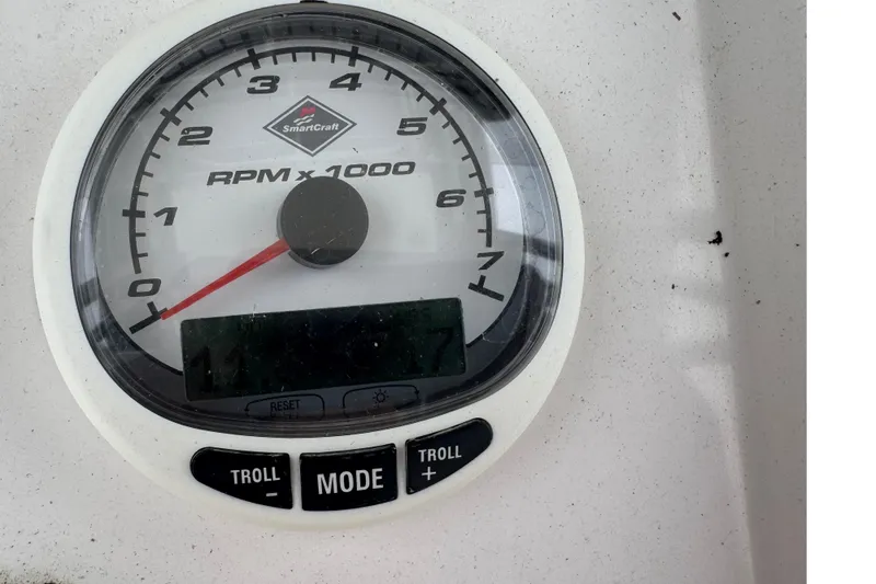 Slide: The Image of Tachometer gauge on 2004 Fountain 31 Sportfish CC Open Bow, displaying RPM with control buttons. - 22