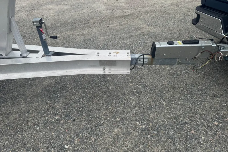 Slide: The Image of Trailer hitch connection for 2004 Fountain 31 Sportfish CC Open Bow on asphalt. - 26