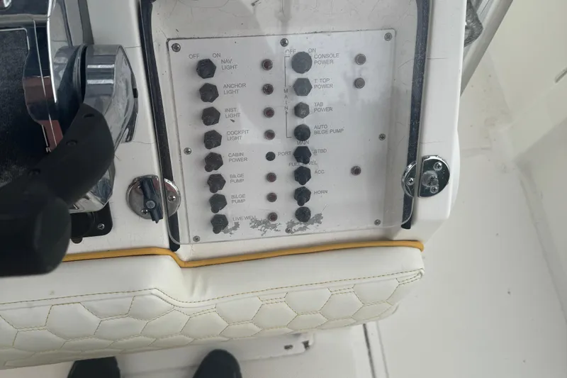 Slide: The Image of Control panel of a 2004 Fountain 31 Sportfish CC Open Bow boat. - 6