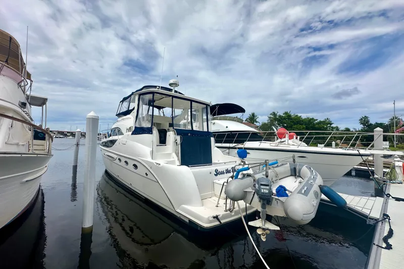 The Image of 2005 Meridian 459 Motoryacht docked at marina under cloudy sky. - 0