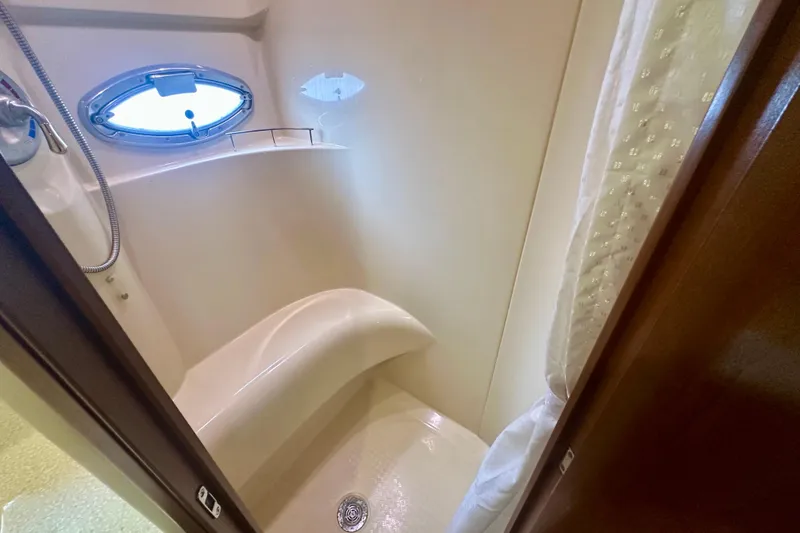 Slide: The Image of Shower area in 2005 Meridian 459 Motoryacht with porthole and curtain. - 30