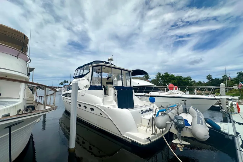 Slide: The Image of 2005 Meridian 459 Motoryacht docked at marina under cloudy sky. - 4
