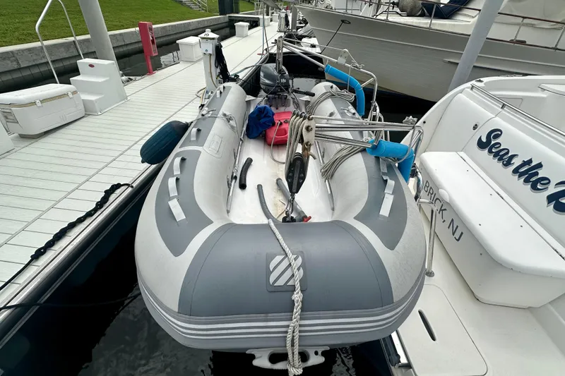 Slide: The Image of Inflatable boat docked beside 2005 Meridian 459 Motoryacht, featuring nautical equipment. - 5