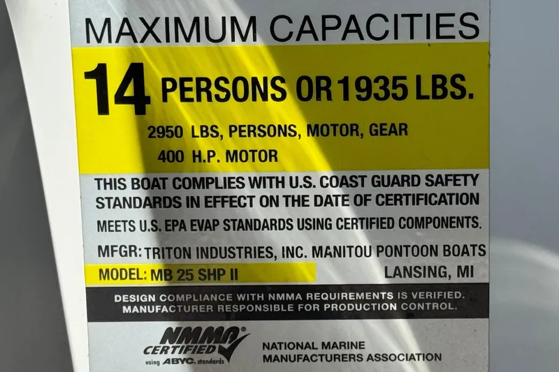 Slide: The Image of 2021 Manitou 25 LX SHP capacity label: 14 persons, 1935 lbs, 400 HP motor compliance. - 29