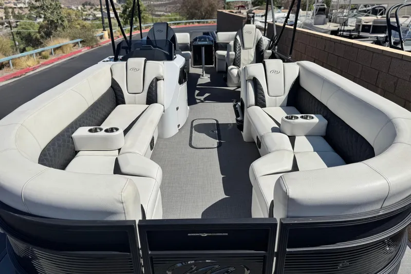 Slide: The Image of 2021 Manitou 25 LX SHP pontoon boat with luxurious seating and modern design. - 8