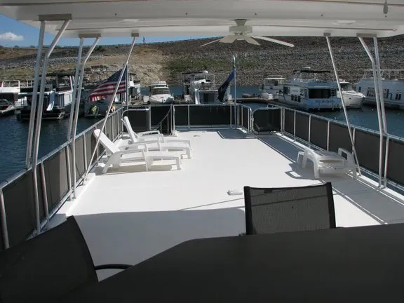 Slide: The Image of Deck of a 2007 Sumerset Solar Express houseboat in harbor. - 14