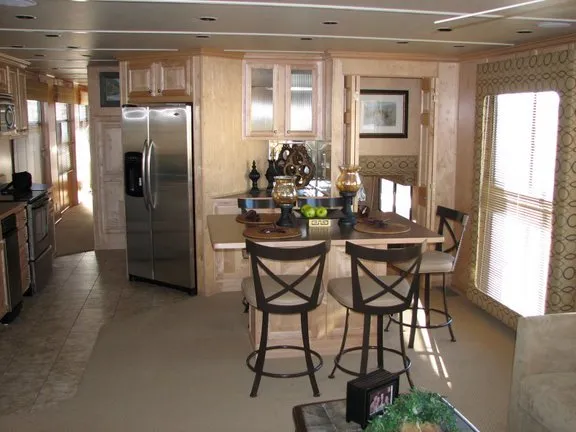 Slide: The Image of Interior of a 2007 Sumerset Solar Express yacht with modern kitchen and dining area. - 3