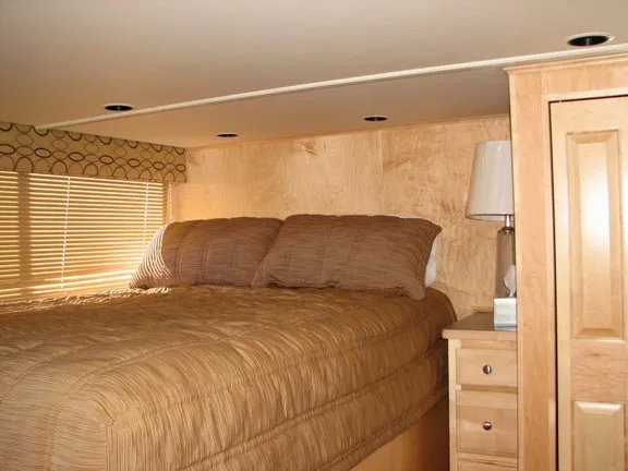 Slide: The Image of Cozy bedroom in a 2007 Sumerset Solar Express houseboat. - 6