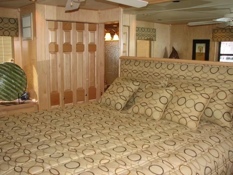 Slide: The Image of Interior of a 2007 Sumerset Solar Express with patterned bedding. - 7