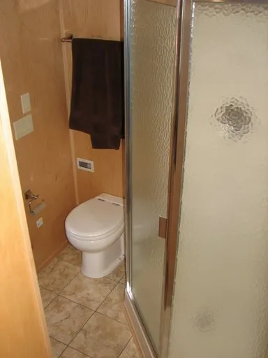 Slide: The Image of Bathroom in 2007 Sumerset Solar Express with shower and toilet. - 8