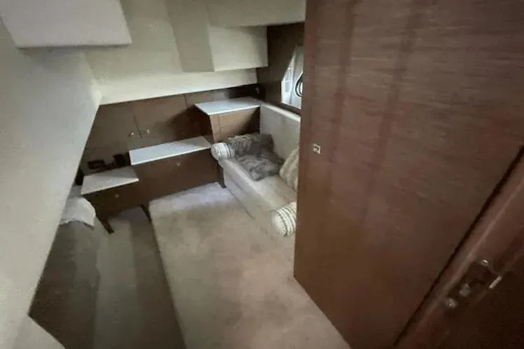 Slide: The Image of Interior of 2018 Cruisers Yachts 390 Express Coupe, featuring cozy seating and modern cabinetry. - 12