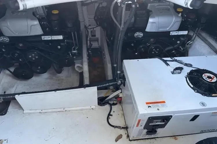 Slide: The Image of Engine compartment of 2018 Cruisers Yachts 390 Express Coupe with visible machinery and components. - 15