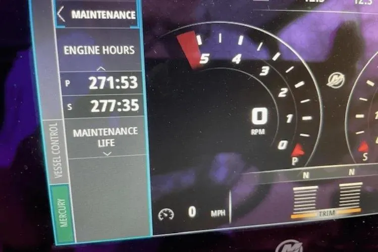 Slide: The Image of Dashboard of 2018 Cruisers Yachts 390 Express Coupe showing engine hours and maintenance details. - 16