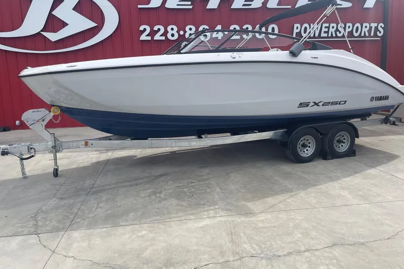 Slide: The Image of 2024 Yamaha Boats SX250 on trailer at JetBlast Powersports dealership. - 5
