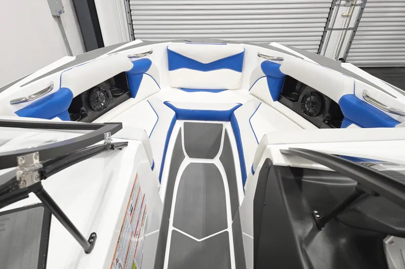 Slide: The Image of 2026 Supreme S220 boat interior with blue and white seating, modern design. - 9