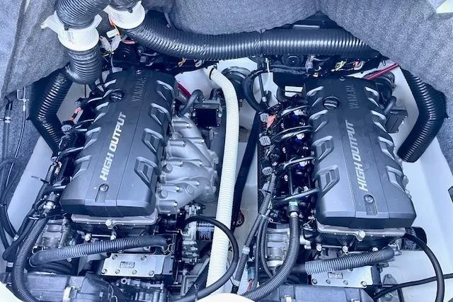 Slide: The Image of Twin high-output engines in a 2015 Yamaha Boats 242 Limited S. - 19