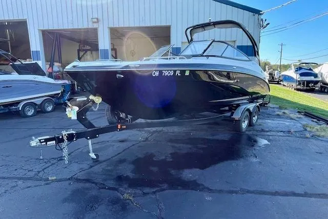 Slide: The Image of 2015 Yamaha Boats 242 Limited S on trailer outside a storage facility. - 3