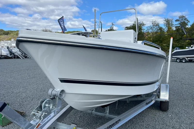 The Image of 2026 Parker 180 Coastal boat on trailer under clear blue sky. - 0