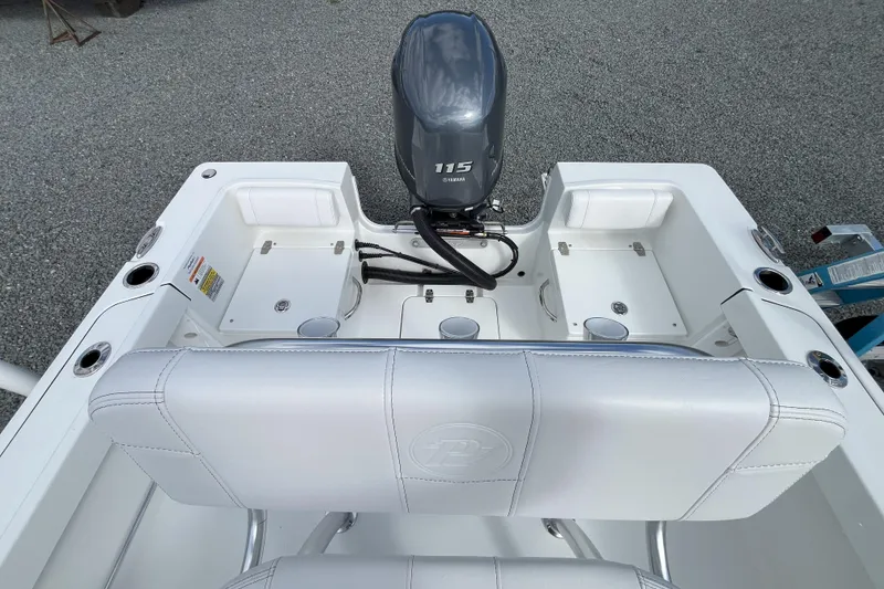 Slide: The Image of 2026 Parker 180 Coastal boat interior with Yamaha 115 engine, white seating, and storage compartments. - 3