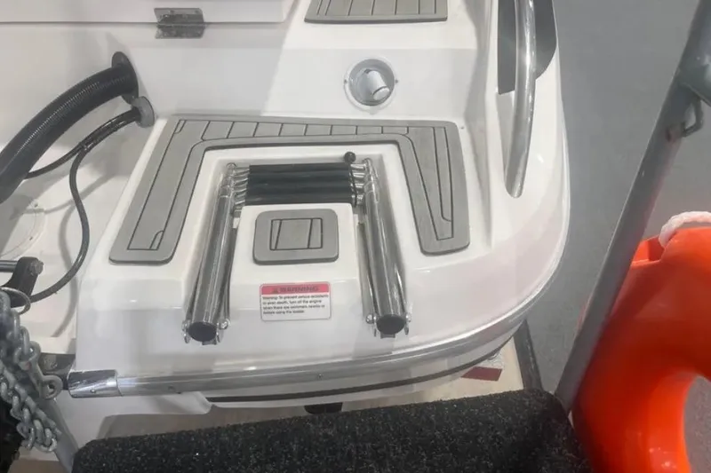 Slide: The Image of 2025 Ventura boat stern with ladder and safety equipment. - 2