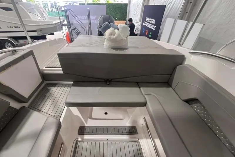 Slide: The Image of 2025 Ventura boat interior with gray seating and elegant design. - 7