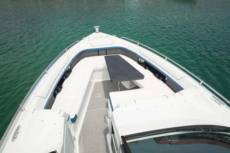 Slide: The Image of 2018 Formula 350 Crossover Bowrider OB interior with sleek design and waterfront view. - 13