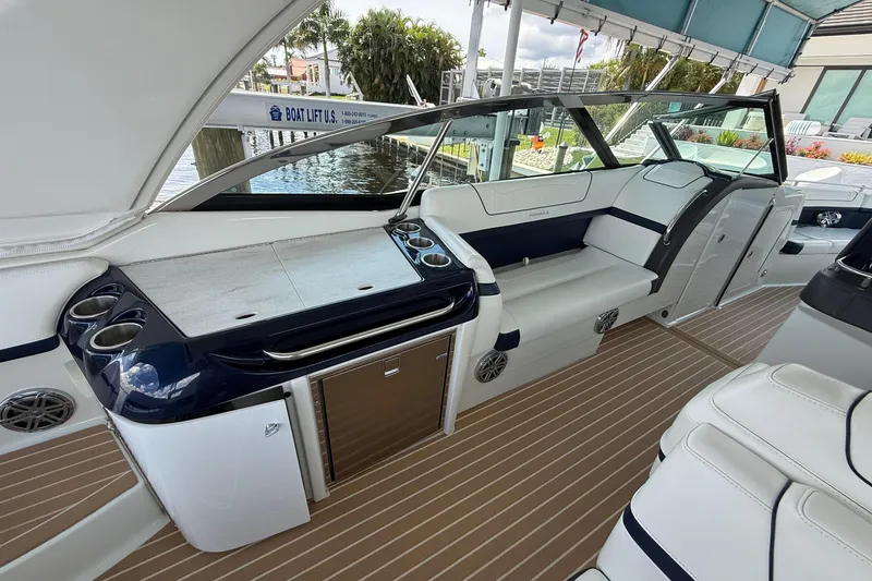 Slide: The Image of 2018 Formula 350 Crossover Bowrider OB cruising on a scenic river. - 2