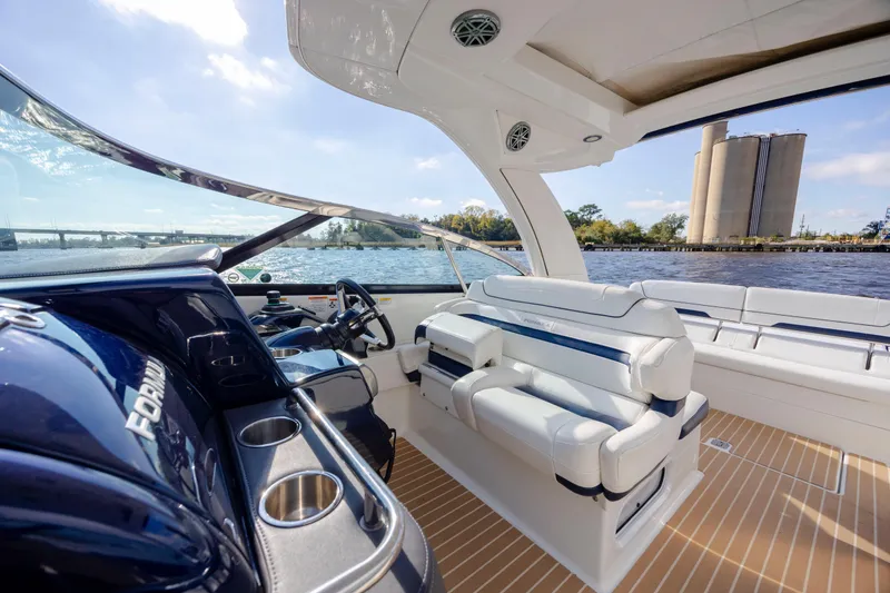 Slide: The Image of 2018 Formula 350 Crossover Bowrider OB interior with luxurious seating and water view. - 24