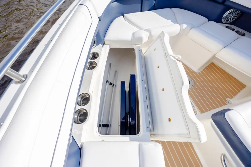 Slide: The Image of 2018 Formula 350 Crossover Bowrider OB interior with open storage compartment. - 28