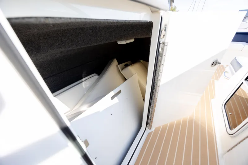 Slide: The Image of Storage compartment in 2018 Formula 350 Crossover Bowrider OB boat, open door view. - 31