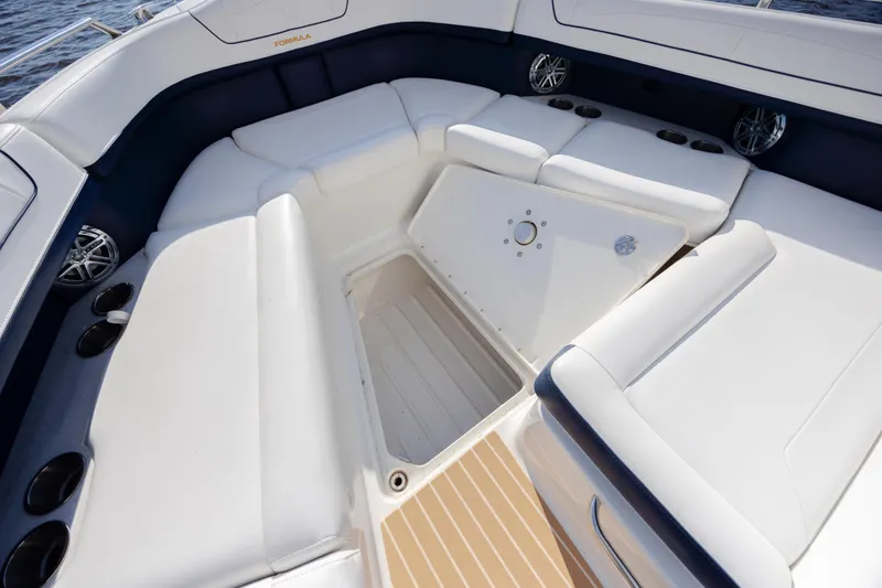 Slide: The Image of 2018 Formula 350 Crossover Bowrider OB interior with white seating and storage compartment. - 32