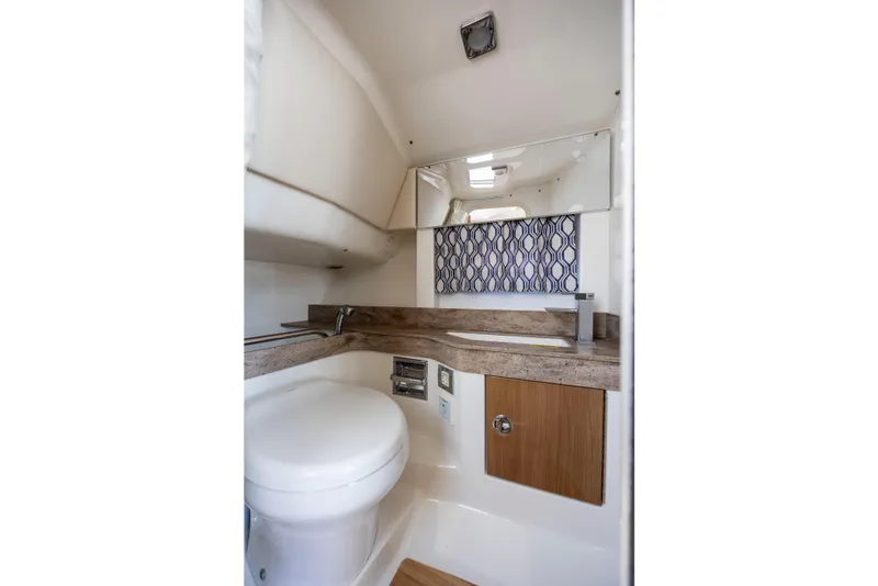 Slide: The Image of 2018 Formula 350 Crossover Bowrider OB bathroom with modern design and compact amenities. - 37