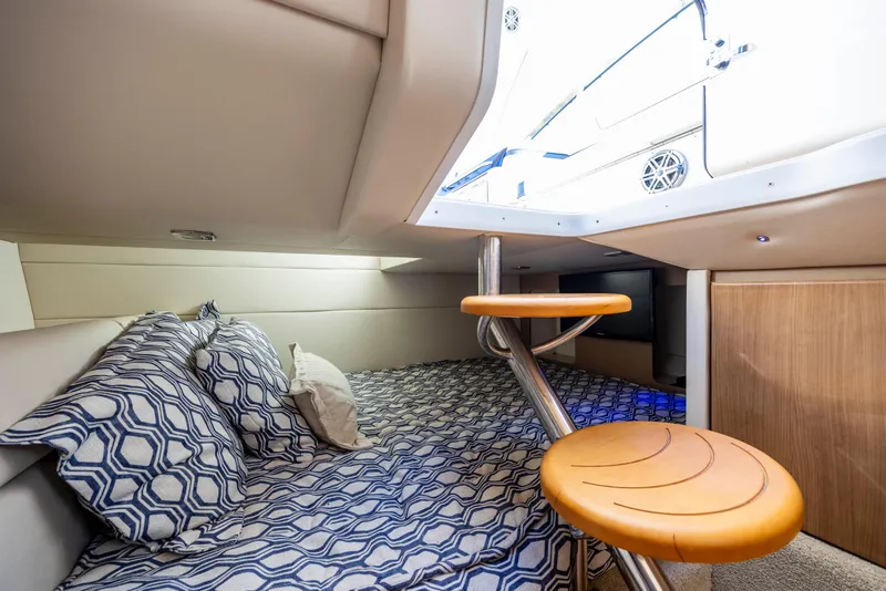 Slide: The Image of 2018 Formula 350 Crossover Bowrider OB cabin interior with patterned bedding and modern design. - 38