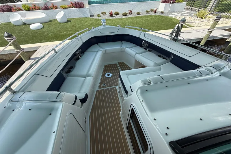 Slide: The Image of 2018 Formula 350 Crossover Bowrider OB cruising on a scenic river. - 5