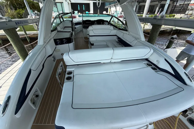 Slide: The Image of 2018 Formula 350 Crossover Bowrider OB cruising on a scenic waterway. - 6