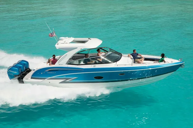 Slide: The Image of 2018 Formula 350 Crossover Bowrider OB with triple Mercury outboard engines on a river. - 9