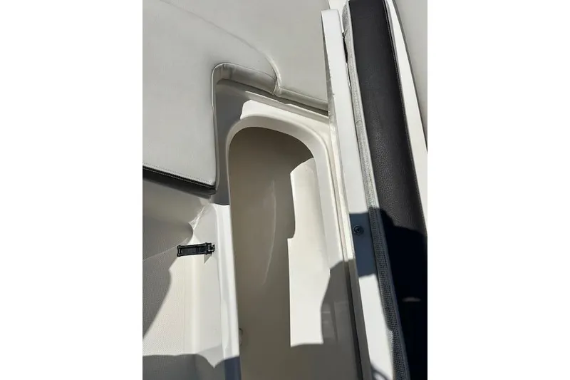 Slide: The Image of 2023 Sailfish 220CC boat interior storage compartment detail. - 5