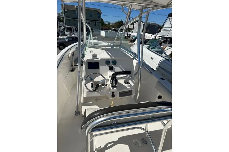 Slide: The Image of 2023 Sailfish 220CC boat cockpit with steering wheel and controls. - 7