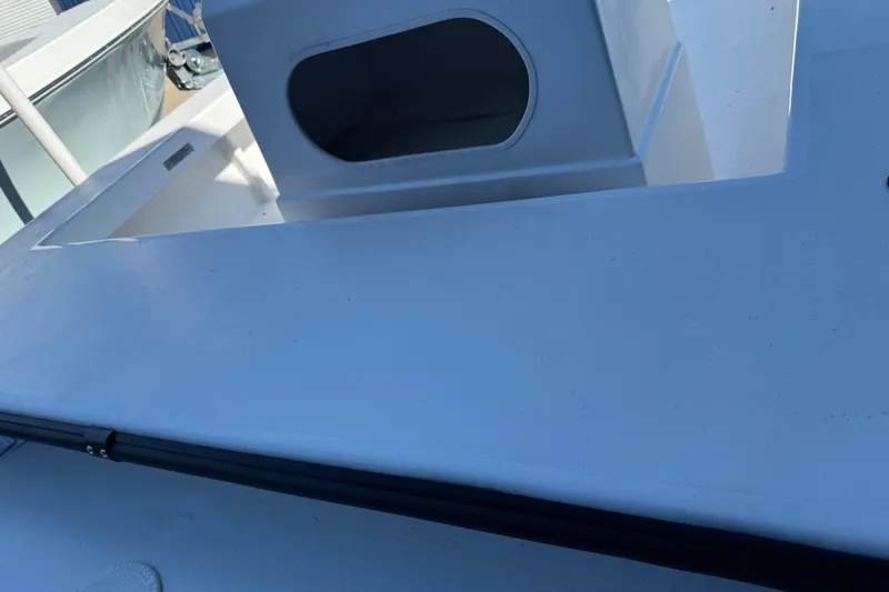 Slide: The Image of 2026 C-Hawk 23 Center Console boat deck with storage compartment. - 10