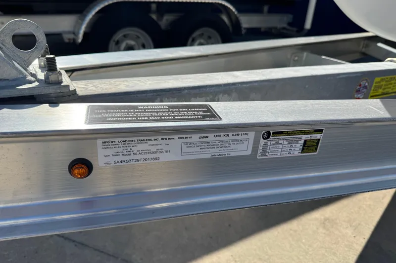 Slide: The Image of Trailer label with specifications and warnings for Load Rite Trailers, Inc., 2026 model. - 14